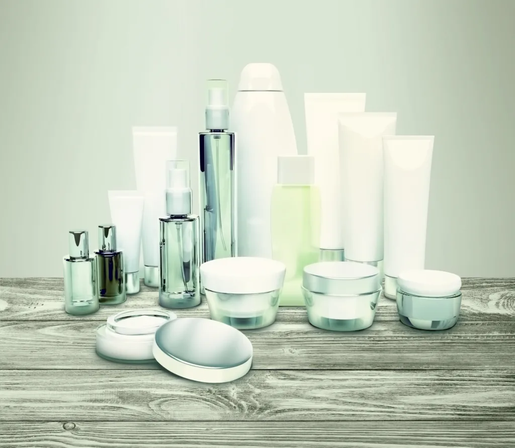 Beauty products packaging items kept on the table in white background